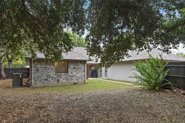 back of property with central air condition unit