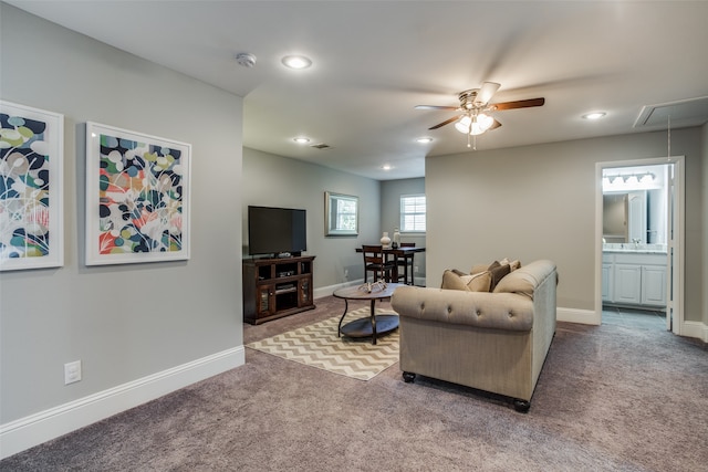 walk in closet featuring dark carpet