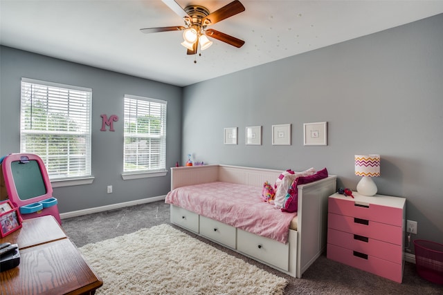 bedroom with dark colored carpet and ceiling fan