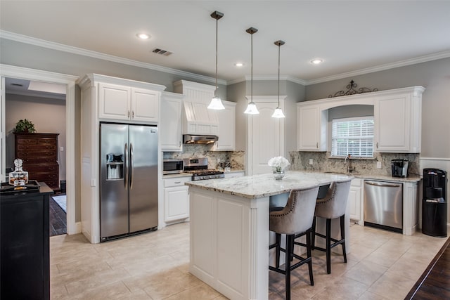 dining area with ornamental molding and light hardwood / wood-style floors