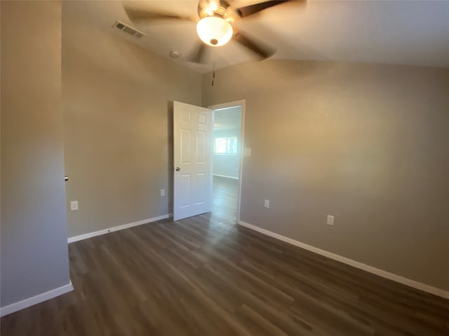 spare room featuring dark hardwood / wood-style flooring and ceiling fan