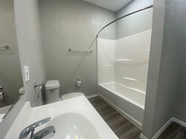 bathroom featuring wood-type flooring, vanity, and toilet