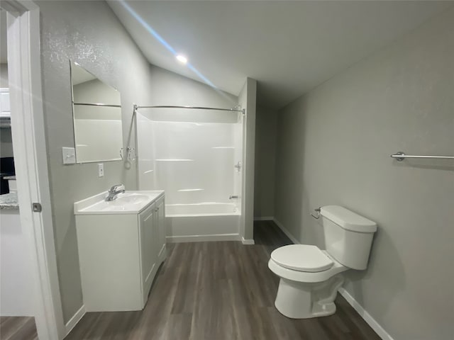 empty room featuring dark hardwood / wood-style flooring, ceiling fan, and vaulted ceiling