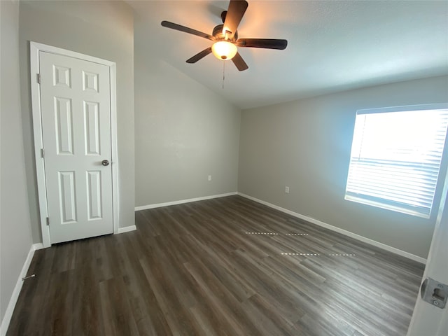 empty room featuring dark hardwood / wood-style floors and ceiling fan