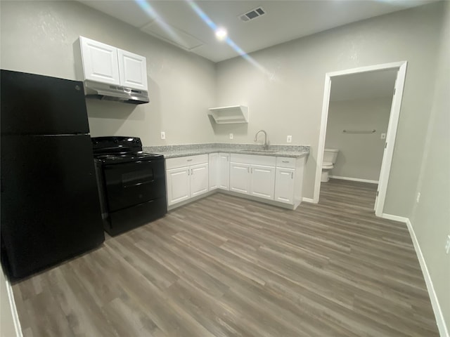 empty room featuring ceiling fan, dark hardwood / wood-style floors, and vaulted ceiling