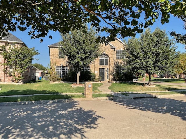 view of front of house with a front lawn