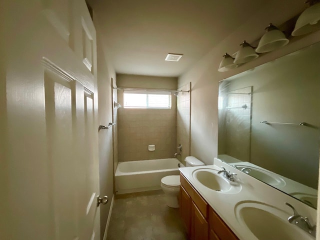 full bathroom with vanity, toilet, and tiled shower / bath