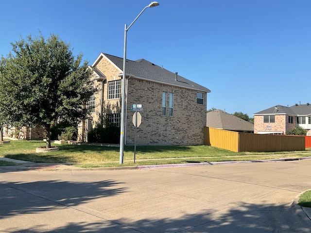 view of home's exterior featuring a lawn