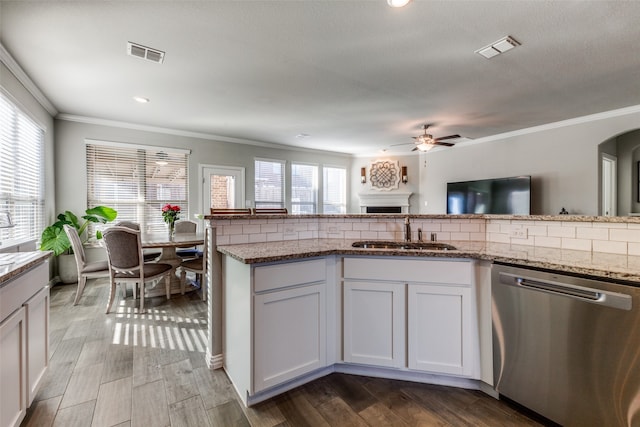 kitchen featuring white cabinets, dishwasher, and hardwood / wood-style floors