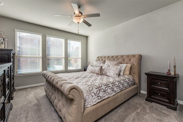 bedroom with carpet floors, multiple windows, and ceiling fan