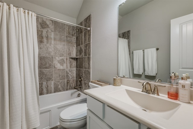 full bathroom with shower / tub combo with curtain, vanity, toilet, and vaulted ceiling