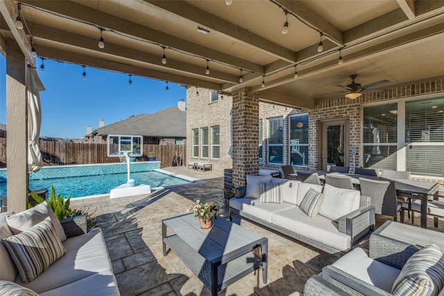 view of patio with ceiling fan and outdoor lounge area