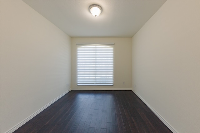 empty room featuring dark hardwood / wood-style floors