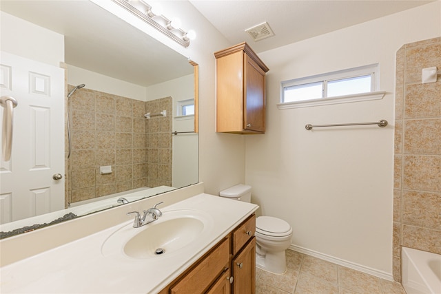 bathroom featuring tile patterned flooring, vanity, and toilet