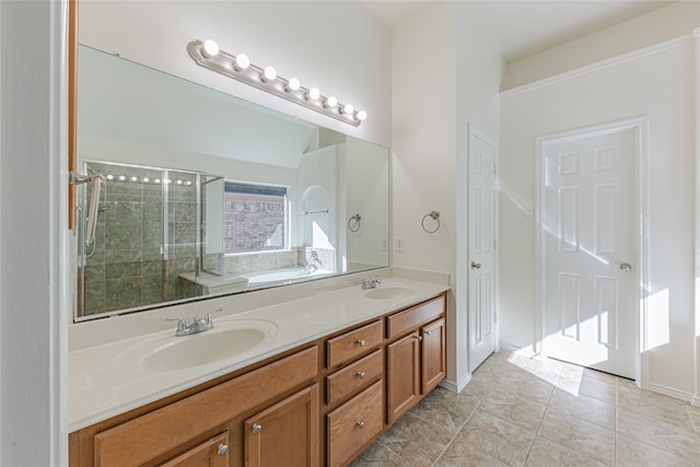 bathroom featuring tile patterned flooring, vanity, and separate shower and tub