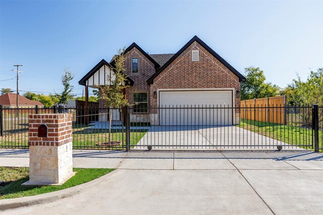 view of front of home with a garage and a front yard