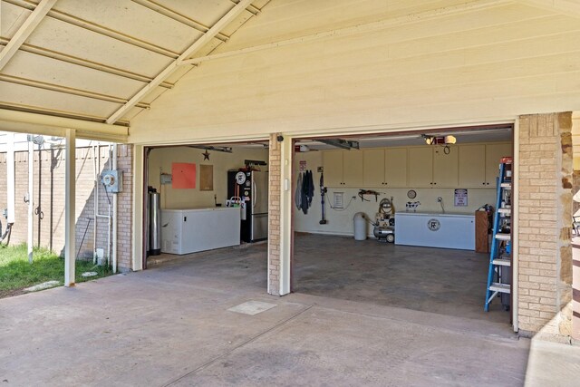 garage with stainless steel fridge