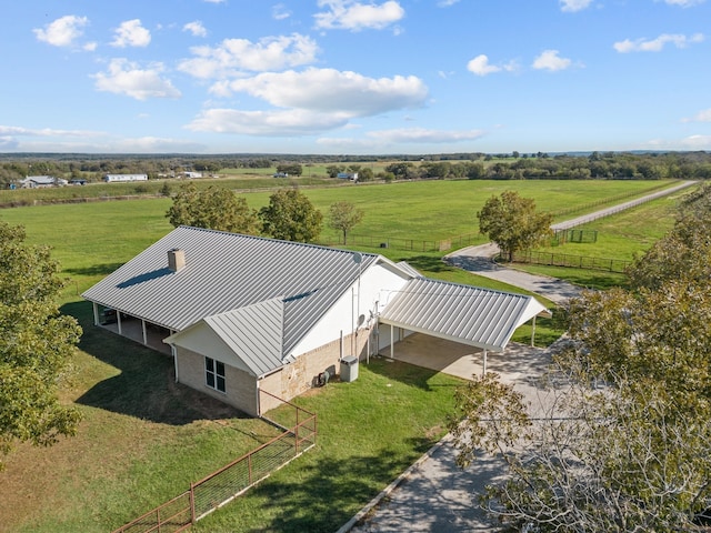 birds eye view of property with a rural view