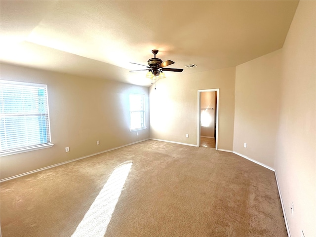 carpeted empty room with ceiling fan