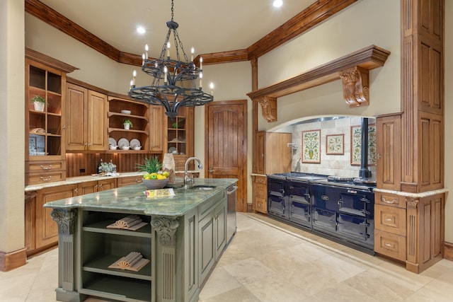 kitchen with light stone countertops, stainless steel dishwasher, crown molding, sink, and an island with sink