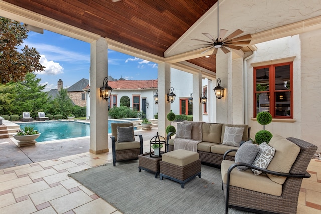 view of patio featuring an outdoor living space and ceiling fan