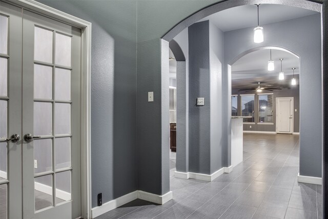 hall featuring tile patterned flooring