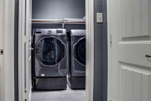 washroom with independent washer and dryer