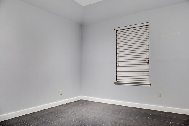 unfurnished room featuring dark hardwood / wood-style floors