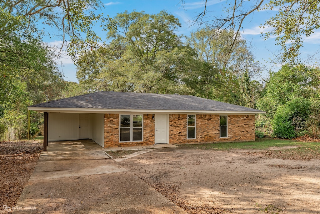 ranch-style house with a carport