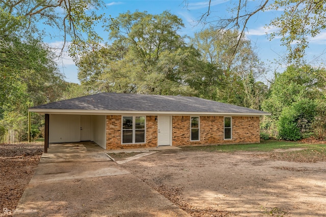 ranch-style house with a carport