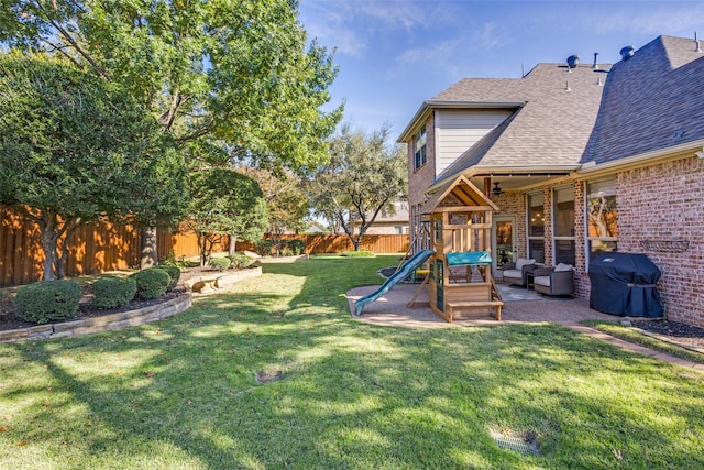 view of yard featuring outdoor lounge area, a patio area, and a playground