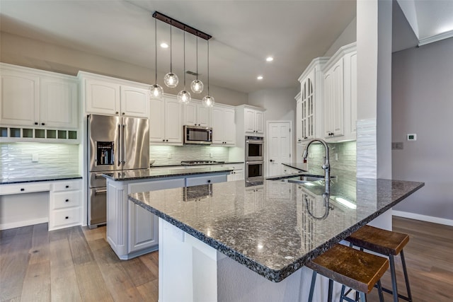 kitchen featuring white cabinetry, sink, and appliances with stainless steel finishes