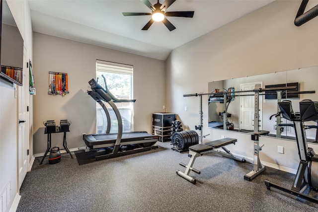 exercise area featuring ceiling fan and vaulted ceiling