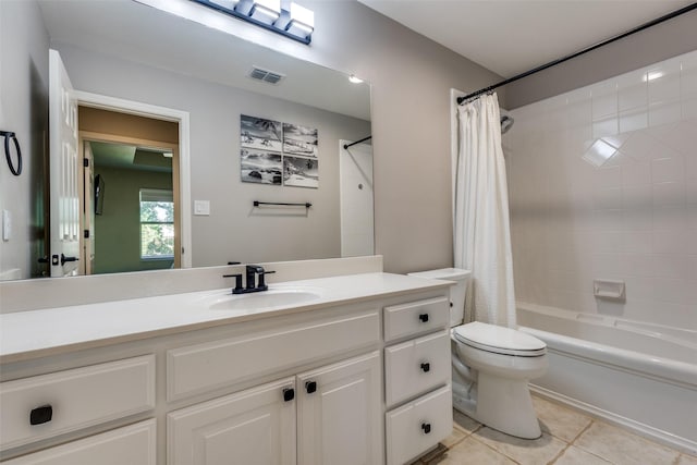 full bathroom featuring tile patterned flooring, vanity, toilet, and shower / bathtub combination with curtain