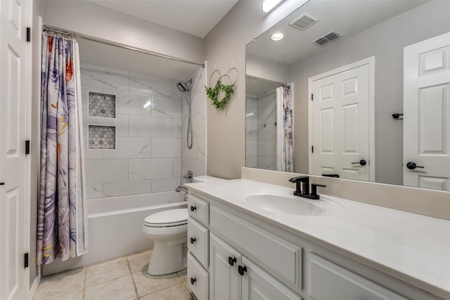 full bathroom with tile patterned flooring, shower / bath combo with shower curtain, vanity, and toilet