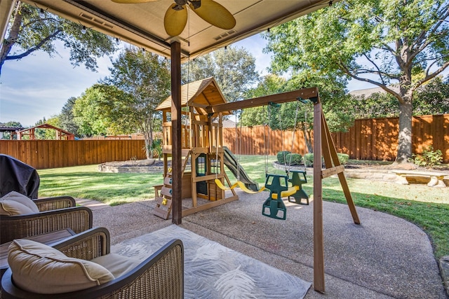 view of patio with ceiling fan and a playground