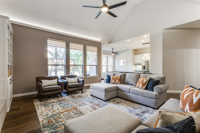 living room featuring ceiling fan, sink, dark wood-type flooring, and high vaulted ceiling