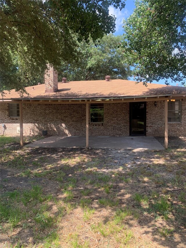 rear view of house with a patio