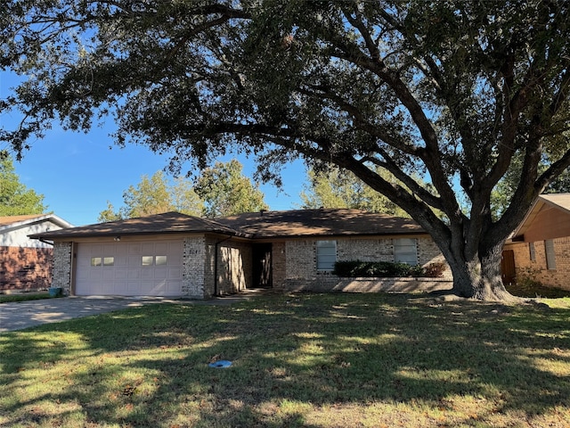 ranch-style home with a garage and a front yard