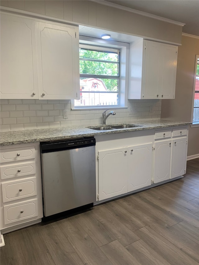 kitchen featuring stainless steel dishwasher, dark hardwood / wood-style floors, white cabinetry, and tasteful backsplash