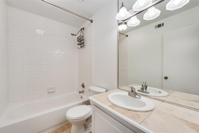 full bathroom with tile patterned floors, vanity, toilet, and tiled shower / bath