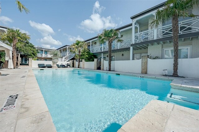 view of swimming pool featuring a patio