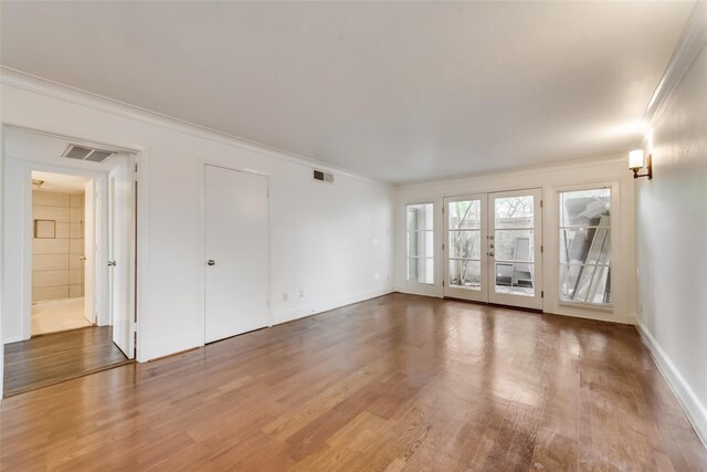 unfurnished room with dark hardwood / wood-style flooring, french doors, and ornamental molding