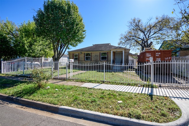 bungalow-style home with a front lawn and a fenced front yard