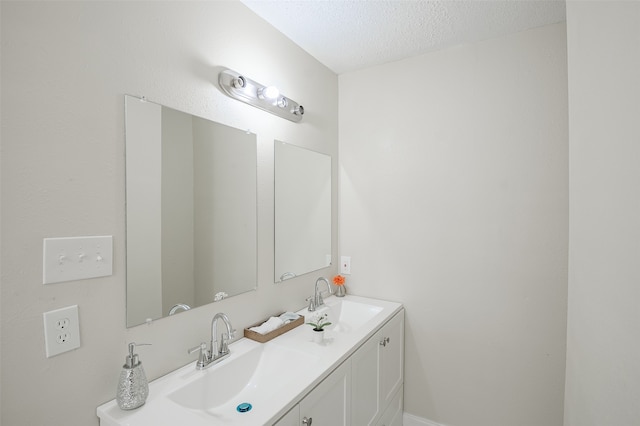 bathroom with vanity and a textured ceiling