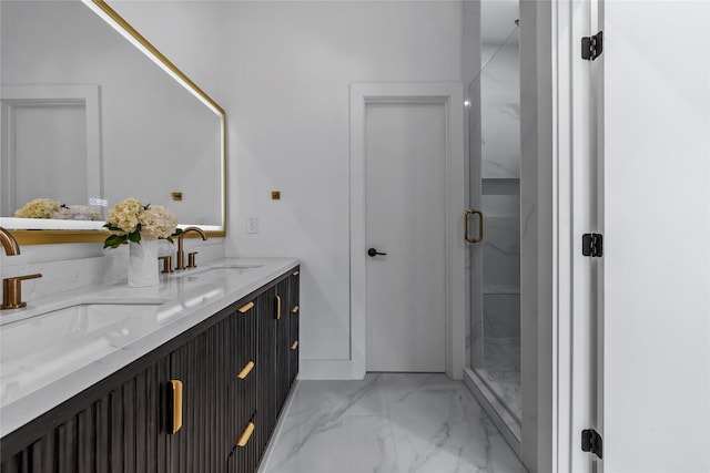 bathroom with vanity and a shower with door