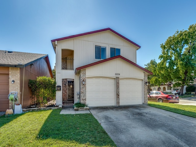 view of front of house with a garage and a front lawn