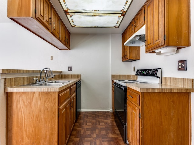 kitchen featuring black appliances, dark parquet flooring, and sink