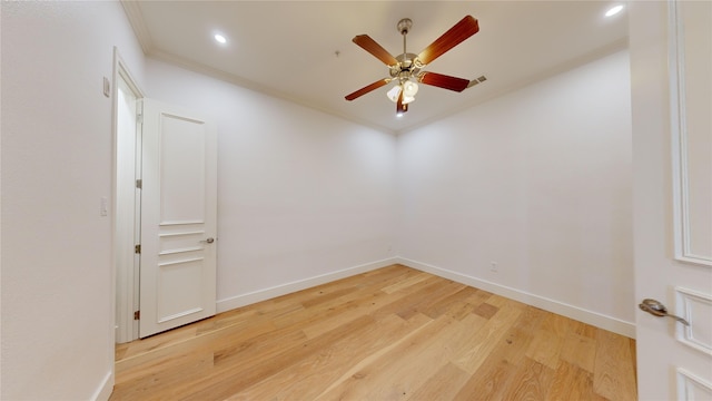 unfurnished room featuring crown molding, ceiling fan, and light hardwood / wood-style flooring