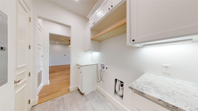 laundry area with hookup for a washing machine, light hardwood / wood-style flooring, cabinets, and ceiling fan